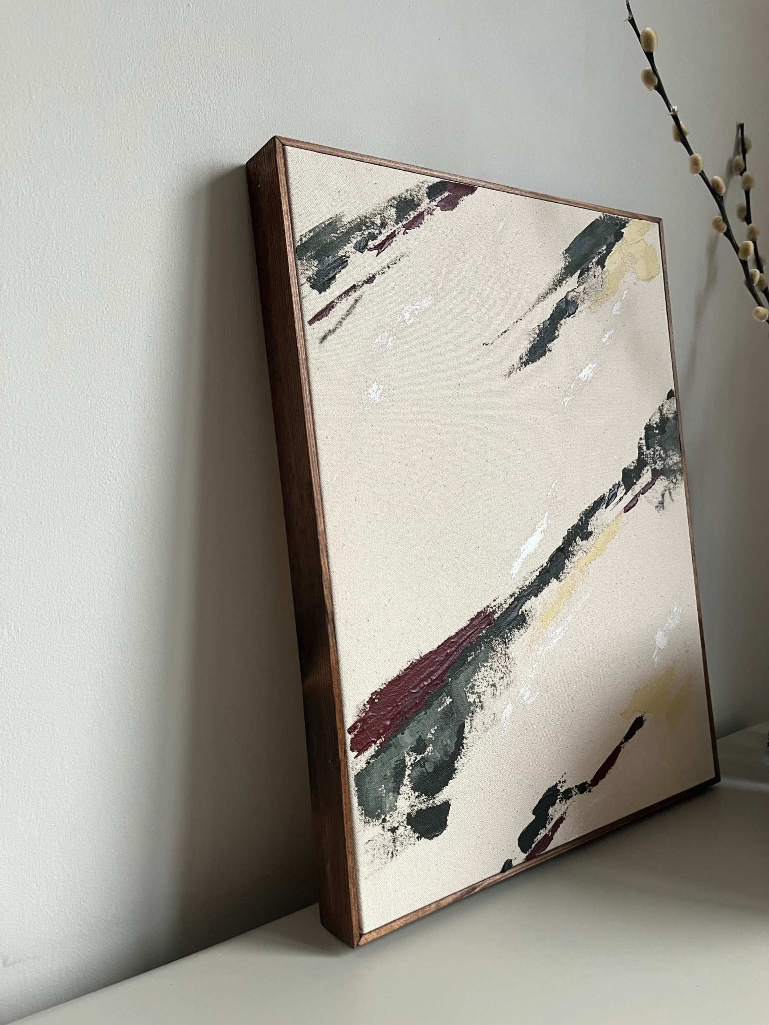 Finished abstract framed canvas artwork created with the Plan Forest Red palette, featuring expressive brushstrokes in deep forest red, muted green, soft beige and white on raw cotton canvas, set in a handcrafted dark oak edge frame.