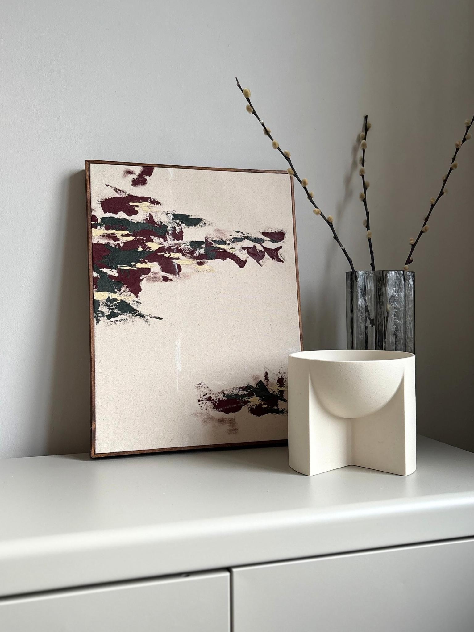 Minimal abstract framed canvas artwork made using the Plan Forest Red art kit, showing layered painterly marks in forest red, charcoal green and warm neutral tones on cotton canvas, finished with a handcrafted wooden edge frame.