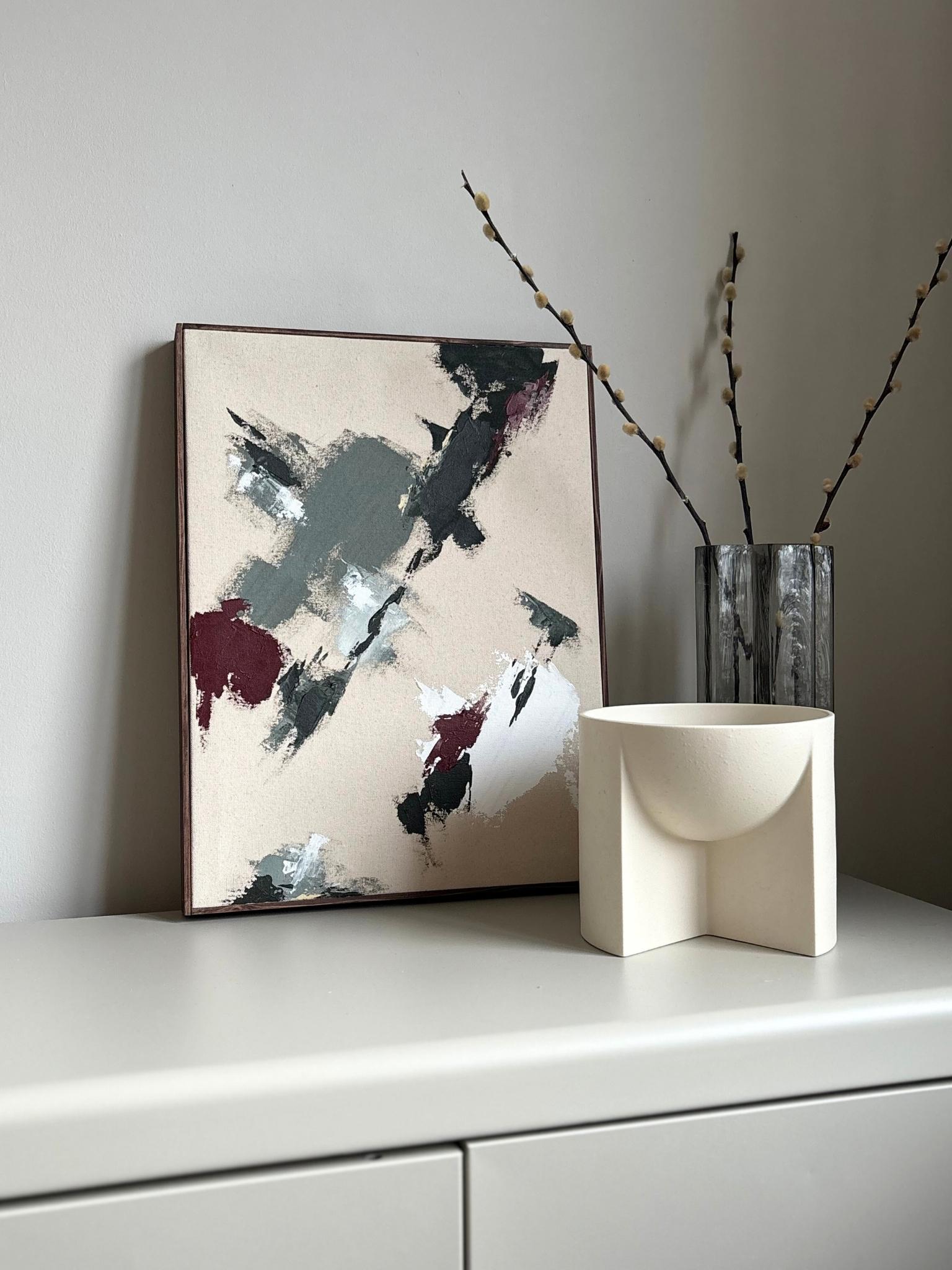 Modern abstract framed artwork created from the Plan Forest Red colour palette, with bold textured brushwork in deep red, earthy green and soft white on raw cotton canvas, professionally framed with a handcrafted dark oak edge frame.