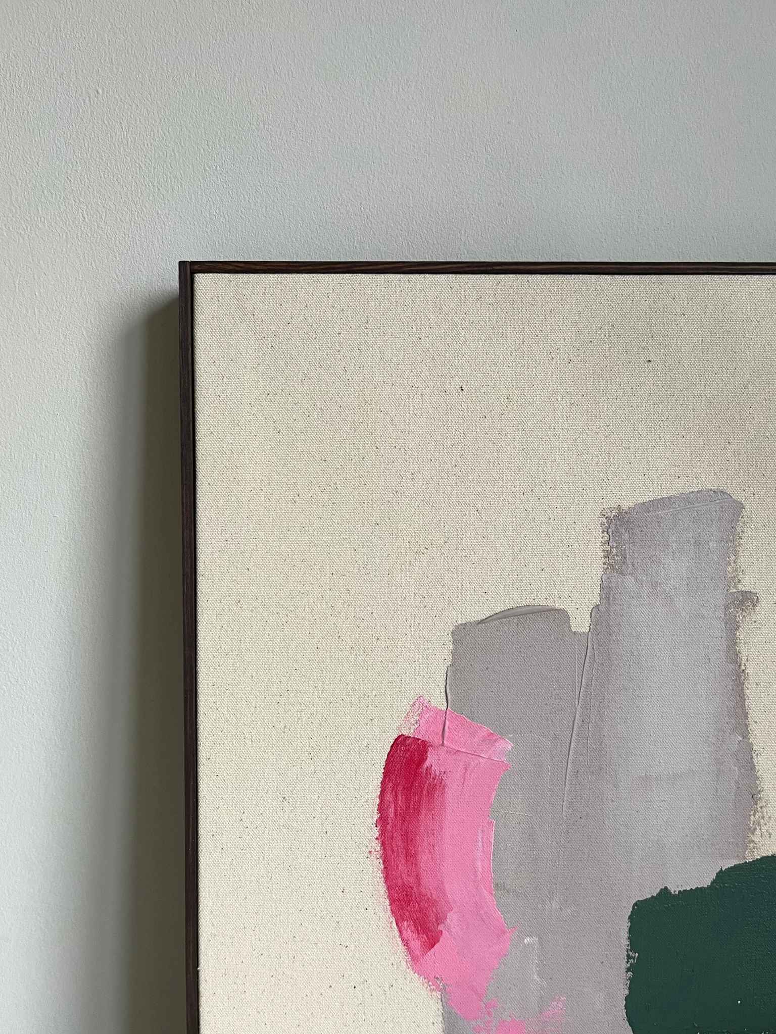 Finished framed abstract painting made using Plan’s Mix (primary colours) palette, with overlapping colour blocks in green, pink and beige on raw cotton canvas, photographed in soft natural light as modern home decor.