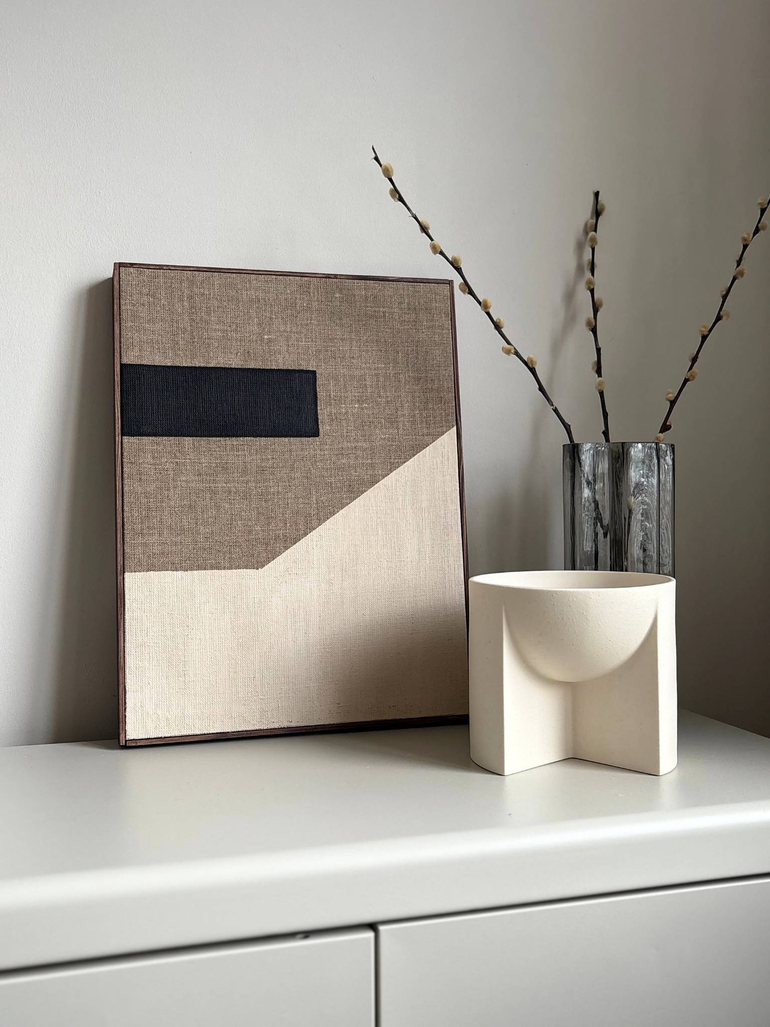 Handcrafted framed monochrome linen canvas artwork featuring bold black forms and soft neutral tones, created from Plan’s monochrome linen palette and photographed as minimalist wall art.