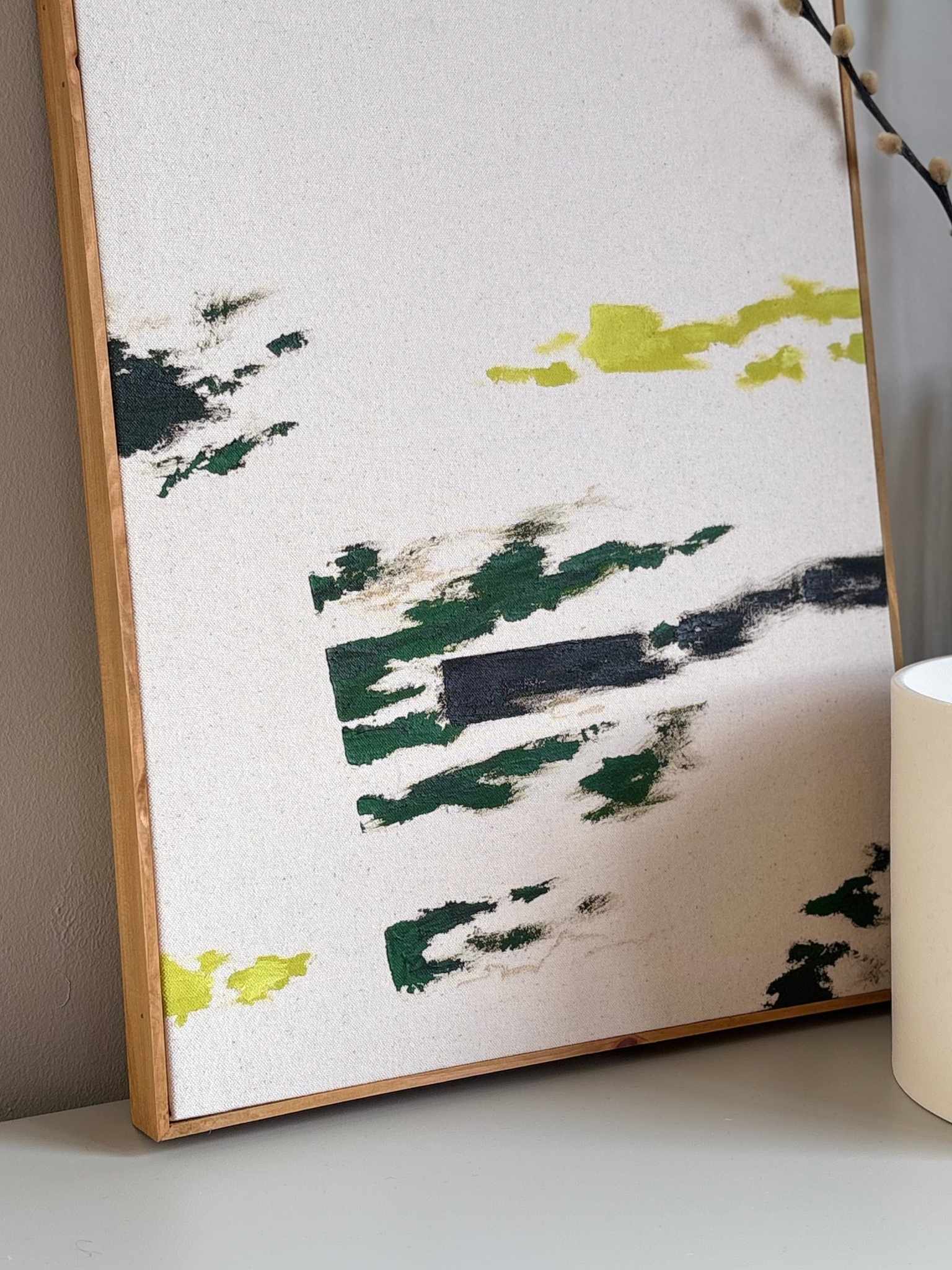 Minimalist abstract framed artwork made using the Plan Olive art kit, featuring expressive painterly marks in olive green, charcoal and warm neutral tones on cotton canvas, framed with a handcrafted wooden edge frame.