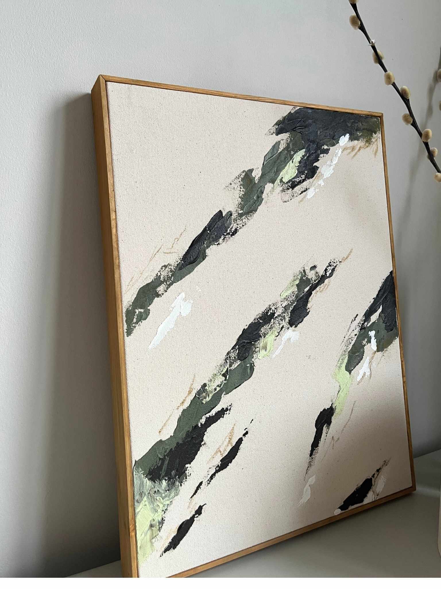 Modern abstract framed canvas artwork created from the Plan Olive colour palette, with layered brushstrokes in soft green, black and white on raw cotton canvas, finished with a handcrafted oak edge frame.