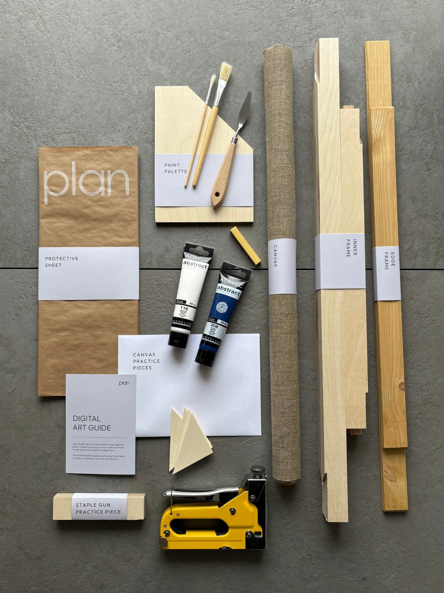 Plan No5 Art Kit, August colour palette in size 50x70cm with oak edge frame — handcrafted frame, linen canvas and all art supplies you need to create bold, expressive abstract artwork at home with rich navy, white, and a yellow soft pastel accent.