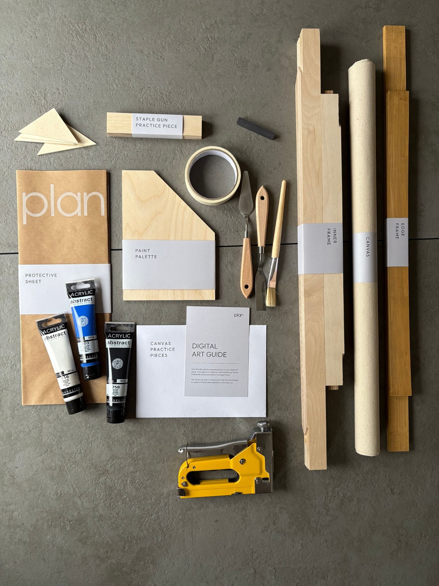 DIY art kit UK for making your own black and white canvas with blue accent. Abstract wall art kit with oak frame, 50 × 70 cm cotton canvas by Plan.