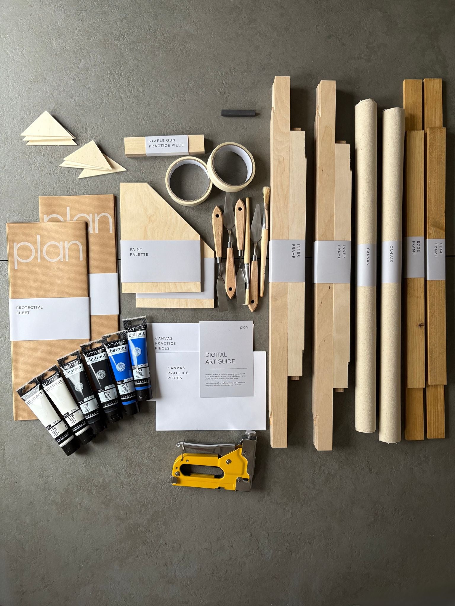 DIY double art kit UK – make two large black and white artworks with blue accent on cotton canvas. 50 × 70 cm oak frame set by Plan. Minimalist wall art kit for modern interiors.