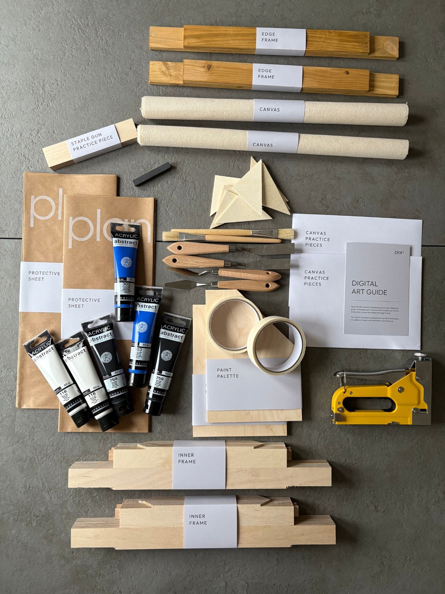 DIY double art kit UK – make two black and white abstract paintings with blue accent on cotton canvas. Oak frame set 30 × 40 cm from Plan. Minimalist DIY wall art and gift idea.