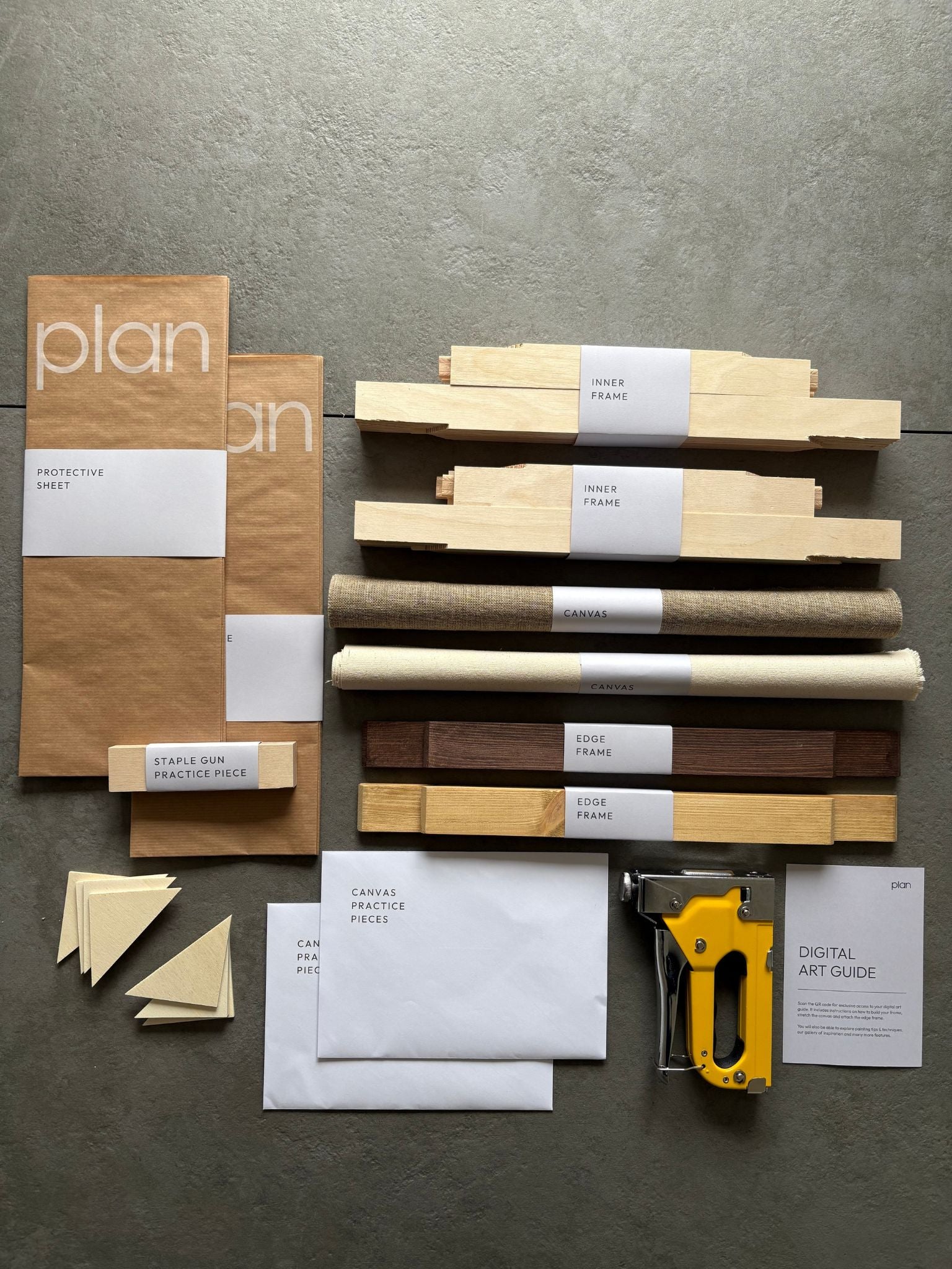 Plan Blank Canvas Double Art Kit in 30×40cm with one oak edge frame and one dark oak edge frame, inner frame pieces, cotton and linen canvases, practice canvas sheets, protective sheet, staple gun and digital art guide. DIY art kit for creating two framed artworks at home in the UK.