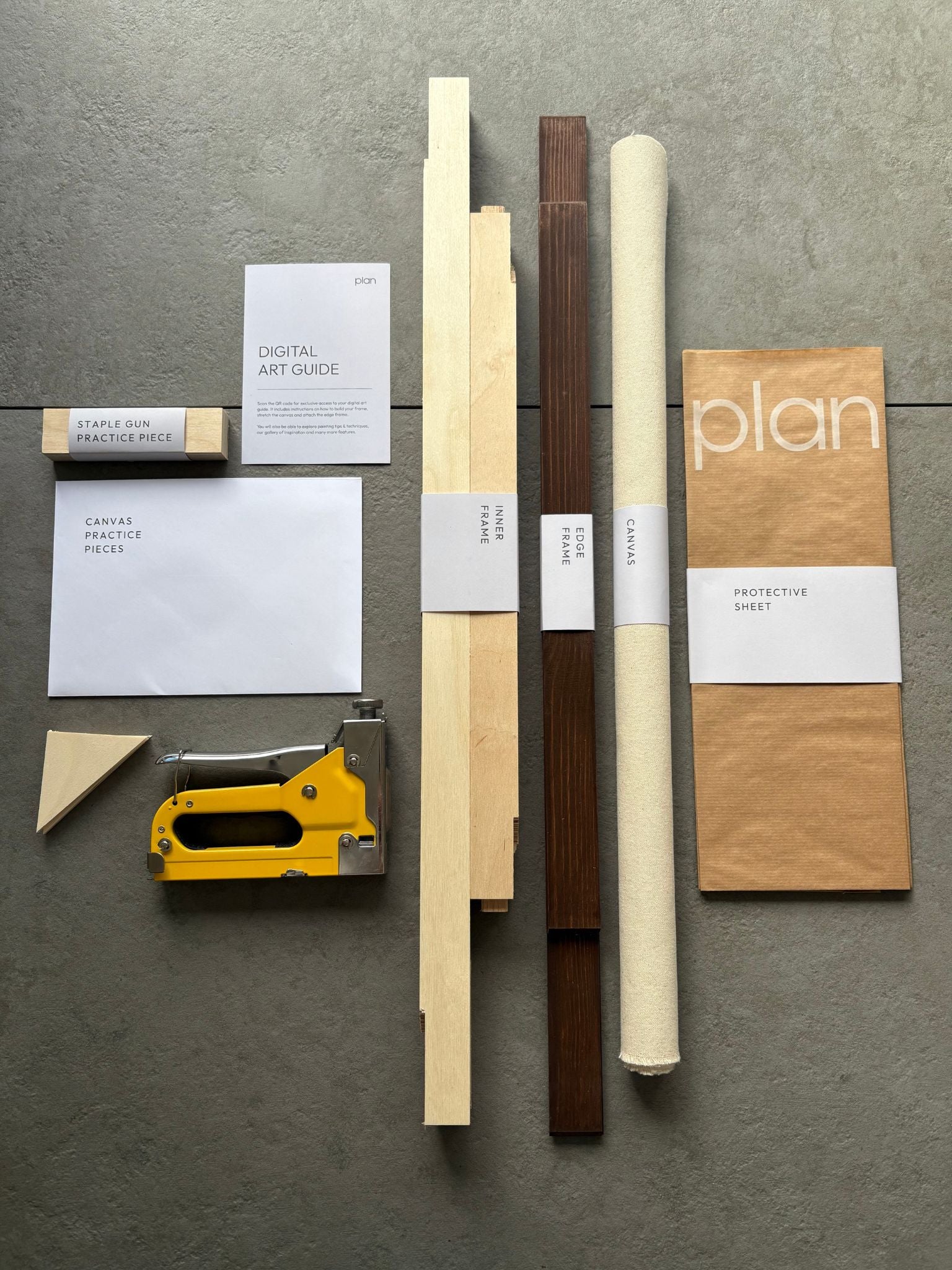 See the contents of the Plan Blank Canvas Art Kit in frame size 50x70cm, dark oak stain. Handcrafted frame with raw cotton and everything you need to put it together.