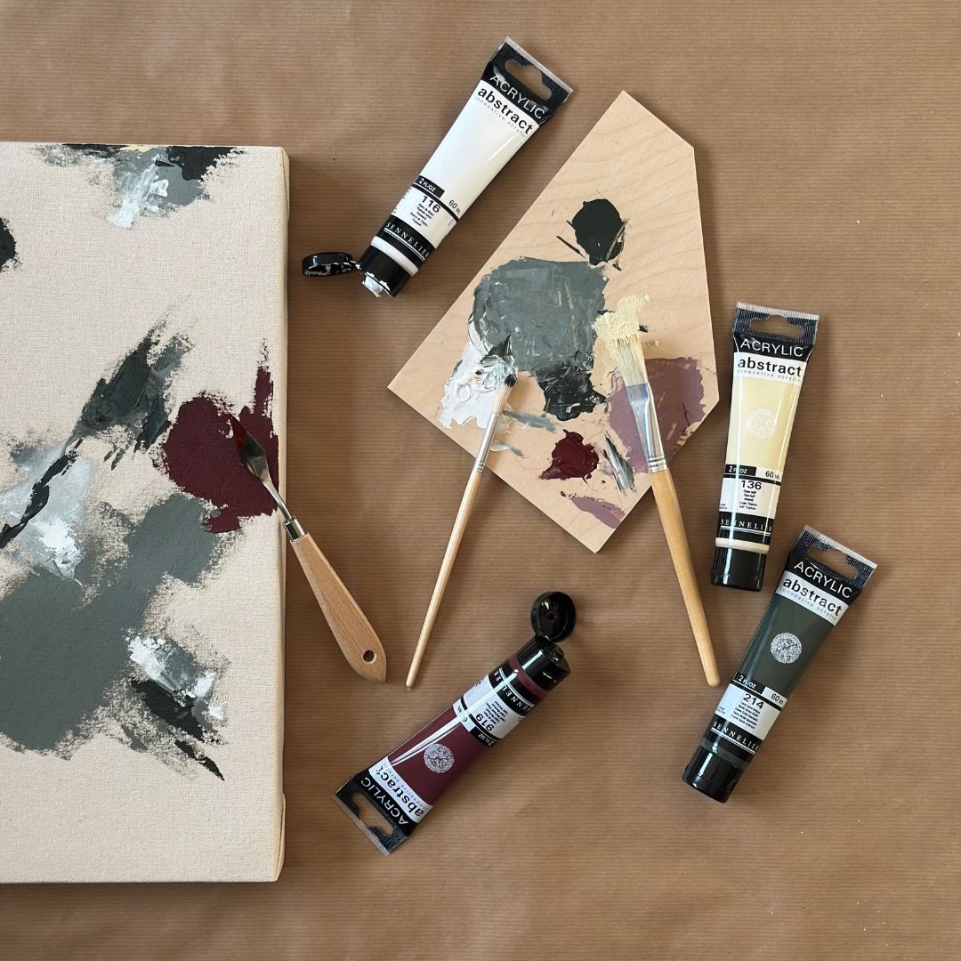 Painting a framed canvas artwork using a curated colour palette from a DIY art kit designed for creating personalised wall art at home.