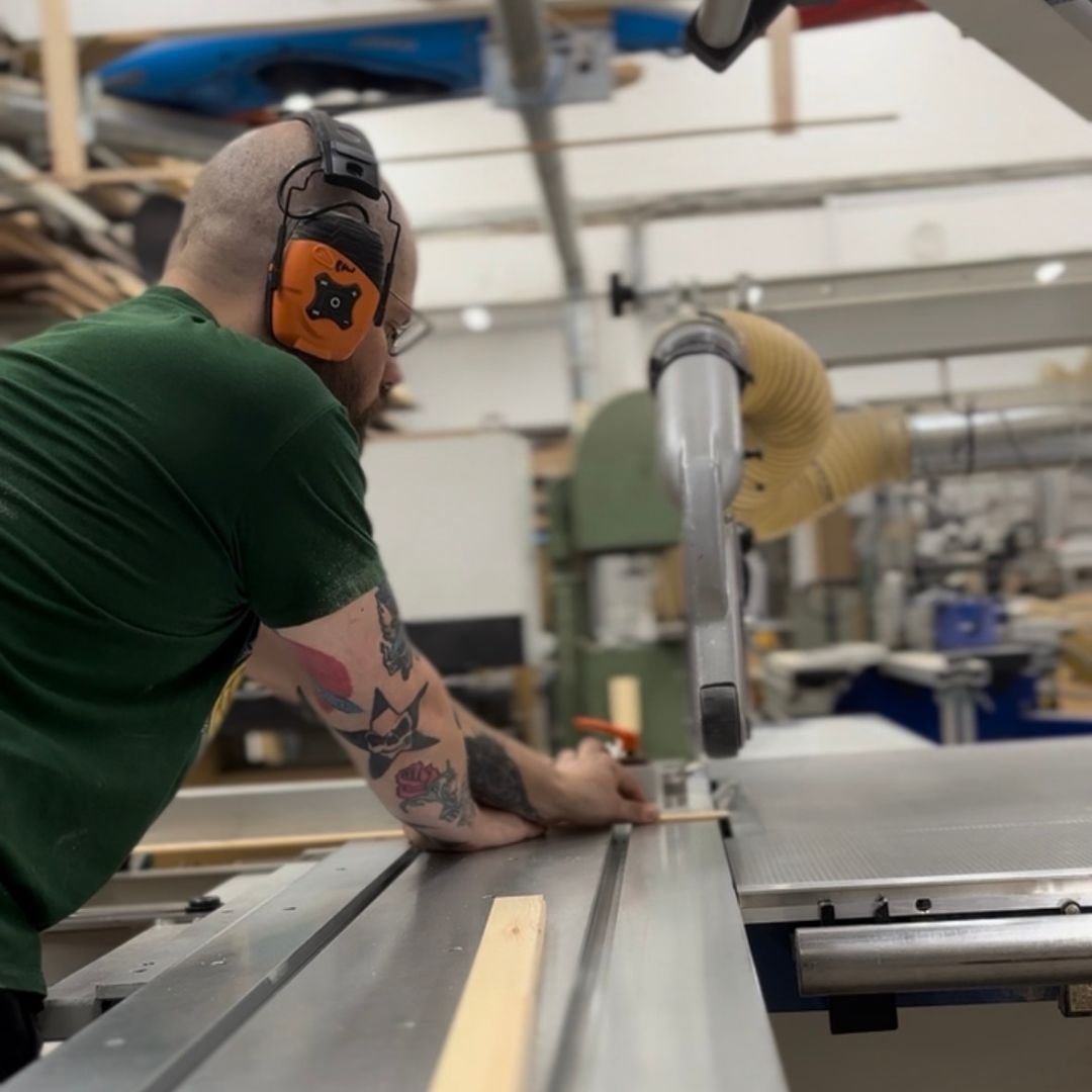 Handcrafting wooden edge frames in a local workshop in Edinburgh as part of a premium DIY framed canvas art kit.