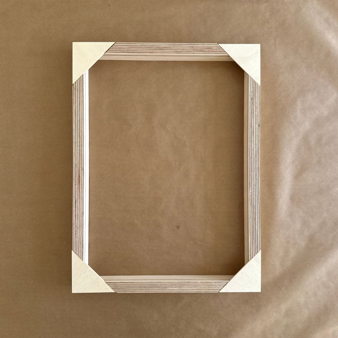 Finished custom inner canvas frame with reinforced corners forming the foundation of a framed canvas artwork