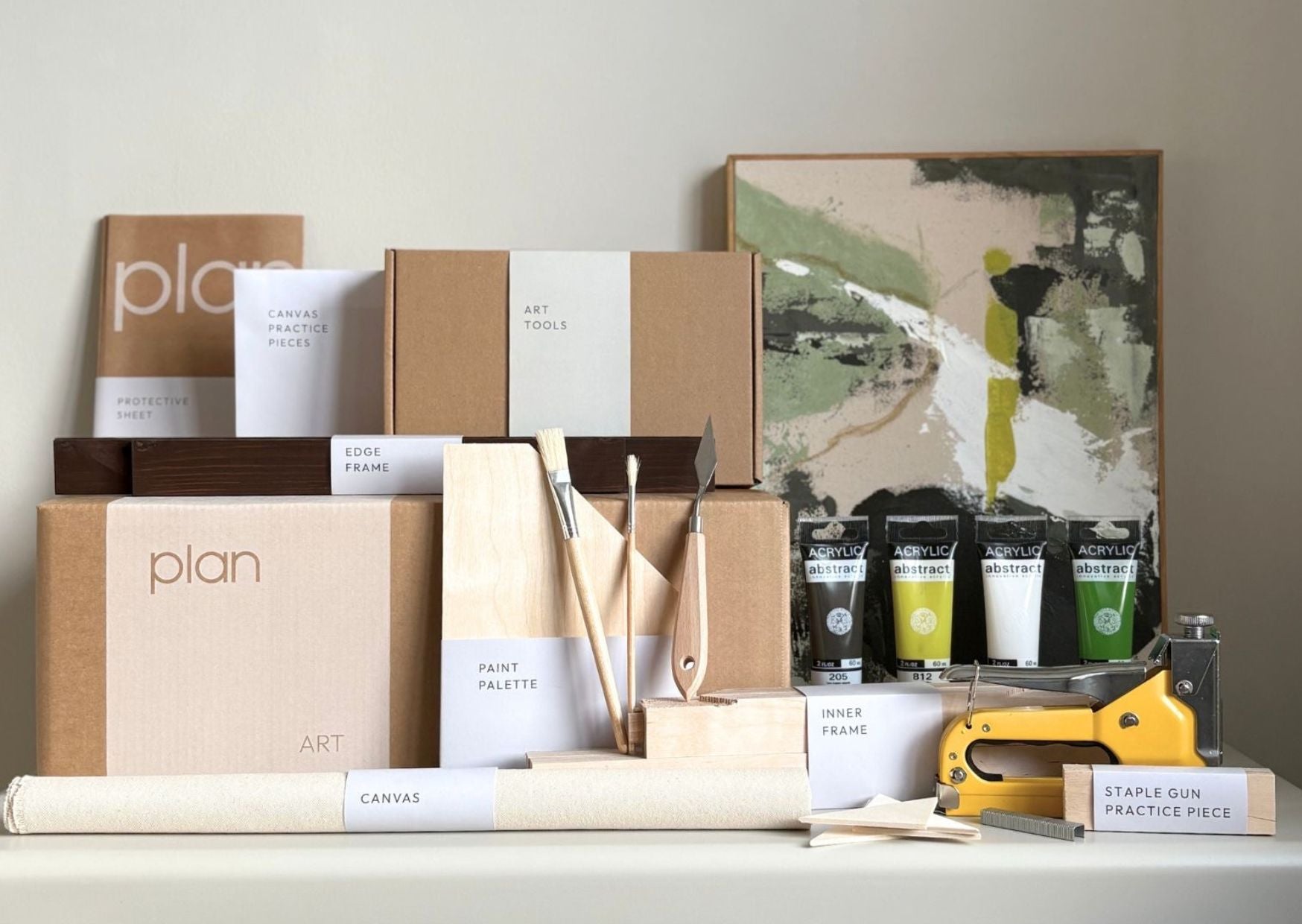 DIY art kit by Plan Art Kits showing frames, canvas, paints and tools to make your own framed artwork at home. Complete art kit designed for creating gallery-style wall art in the UK.