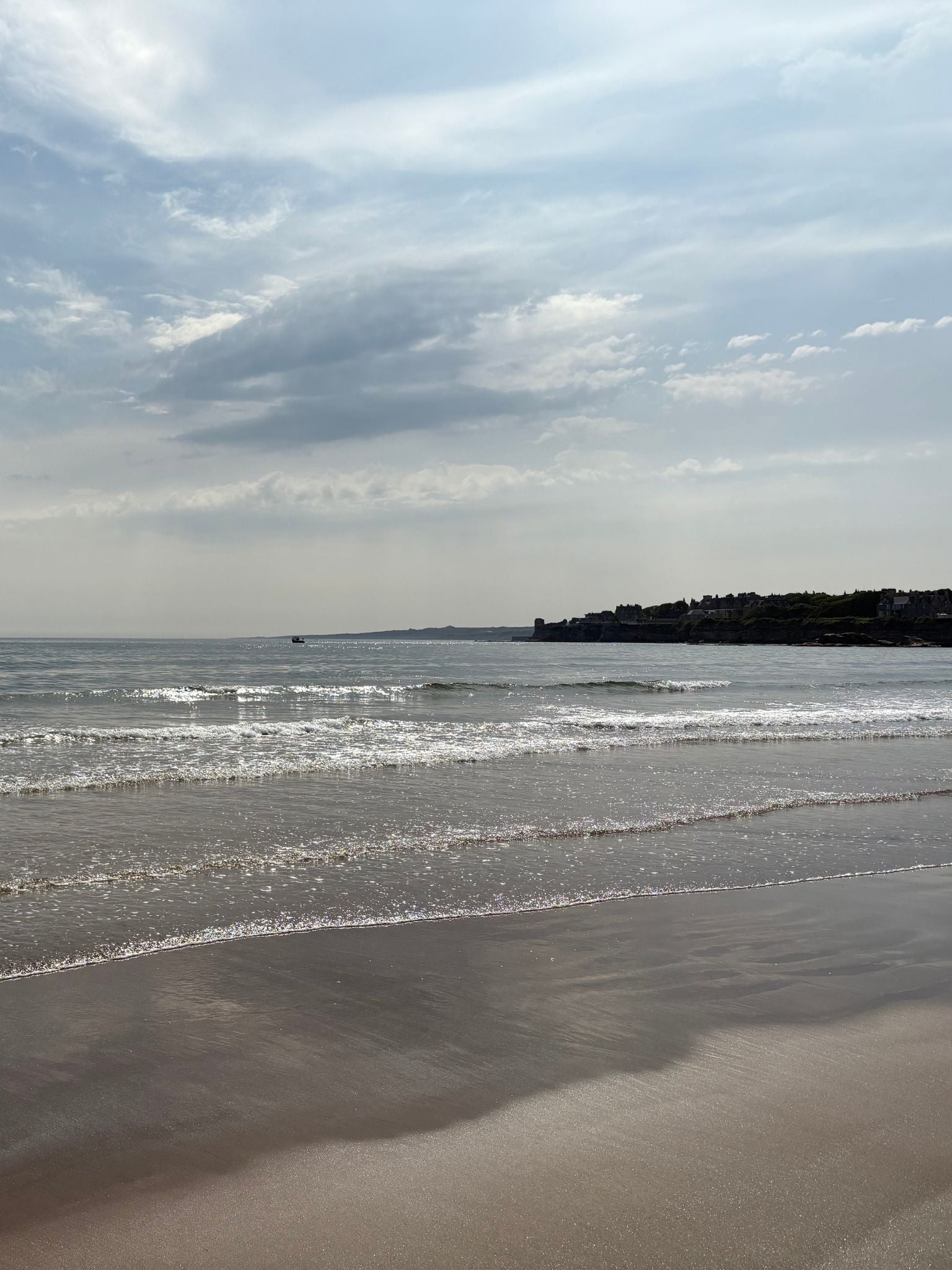 Calm shoreline with gentle waves and muted coastal tones, inspiring the navy blue and soft neutral elements of the Navy & Bright framed canvas art kit colour palette.