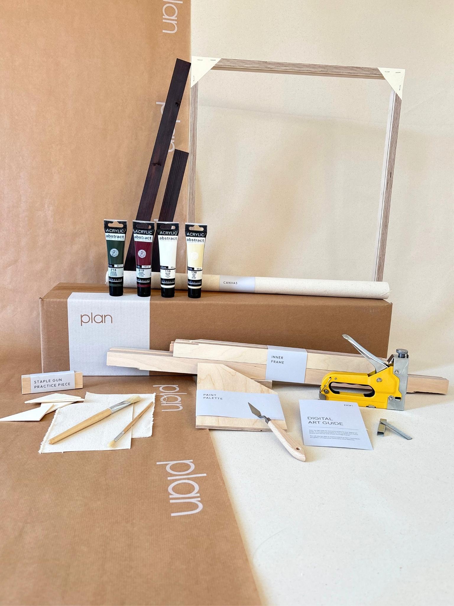 Forest Red framed canvas art kit by Plan, medium 50 x 70 cm size with dark oak edge frame, showing frame, cotton canvas, acrylic paints and art tools