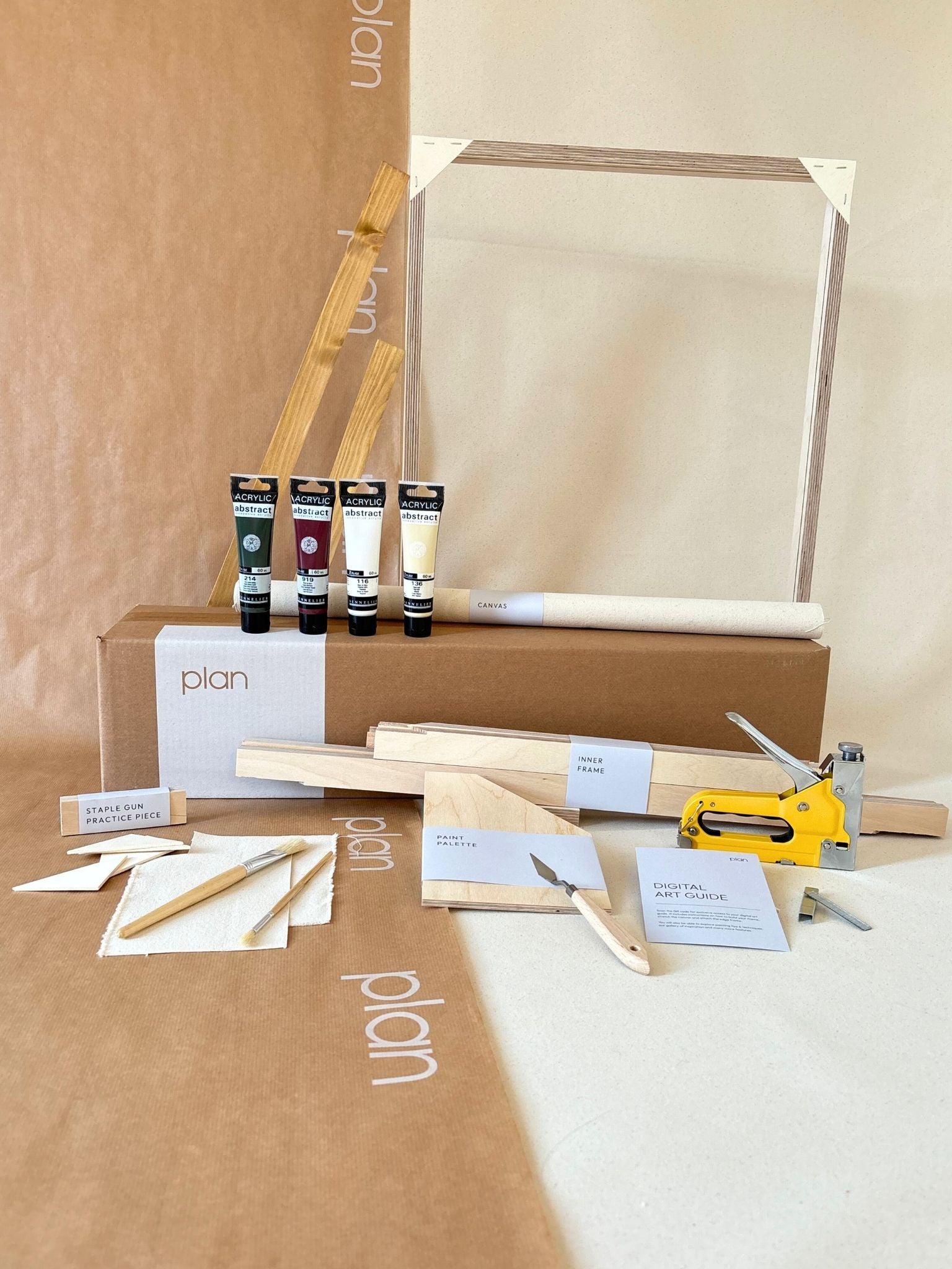 Forest Red framed canvas art kit by Plan, medium 50 x 70 cm size with oak edge frame, showing frame, cotton canvas, acrylic paints and art tools