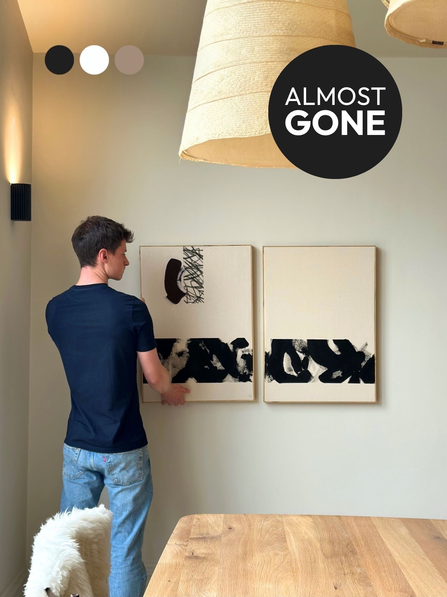 Finished monochrome abstract canvas artworks created with the Plan DIY framed canvas double art kit, shown being styled on the wall in a calm, modern home interior.