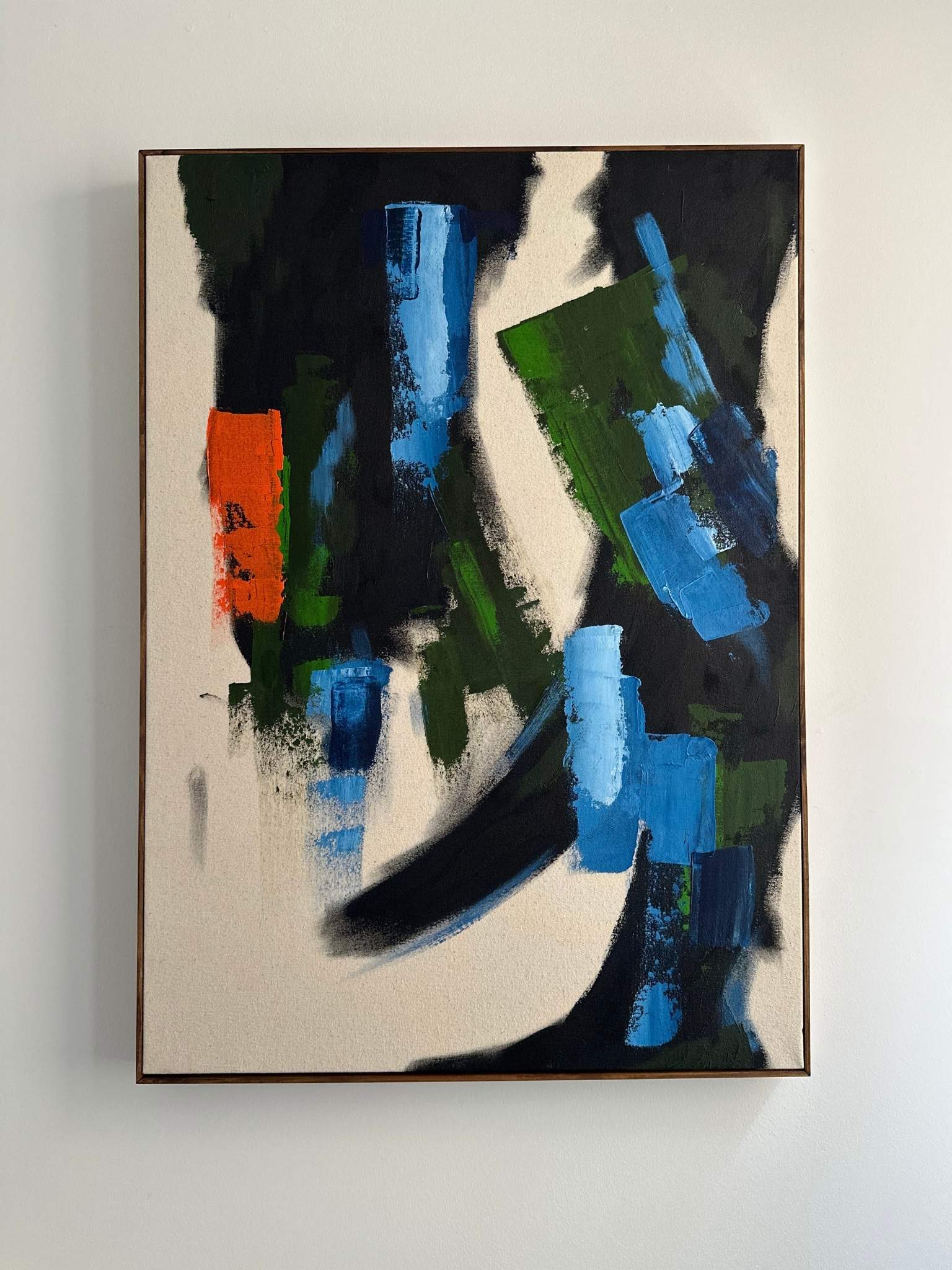 Finished abstract canvas artwork created with the Navy & Bright framed canvas art kit, featuring layered navy, blue, green and black brushstrokes on raw canvas.