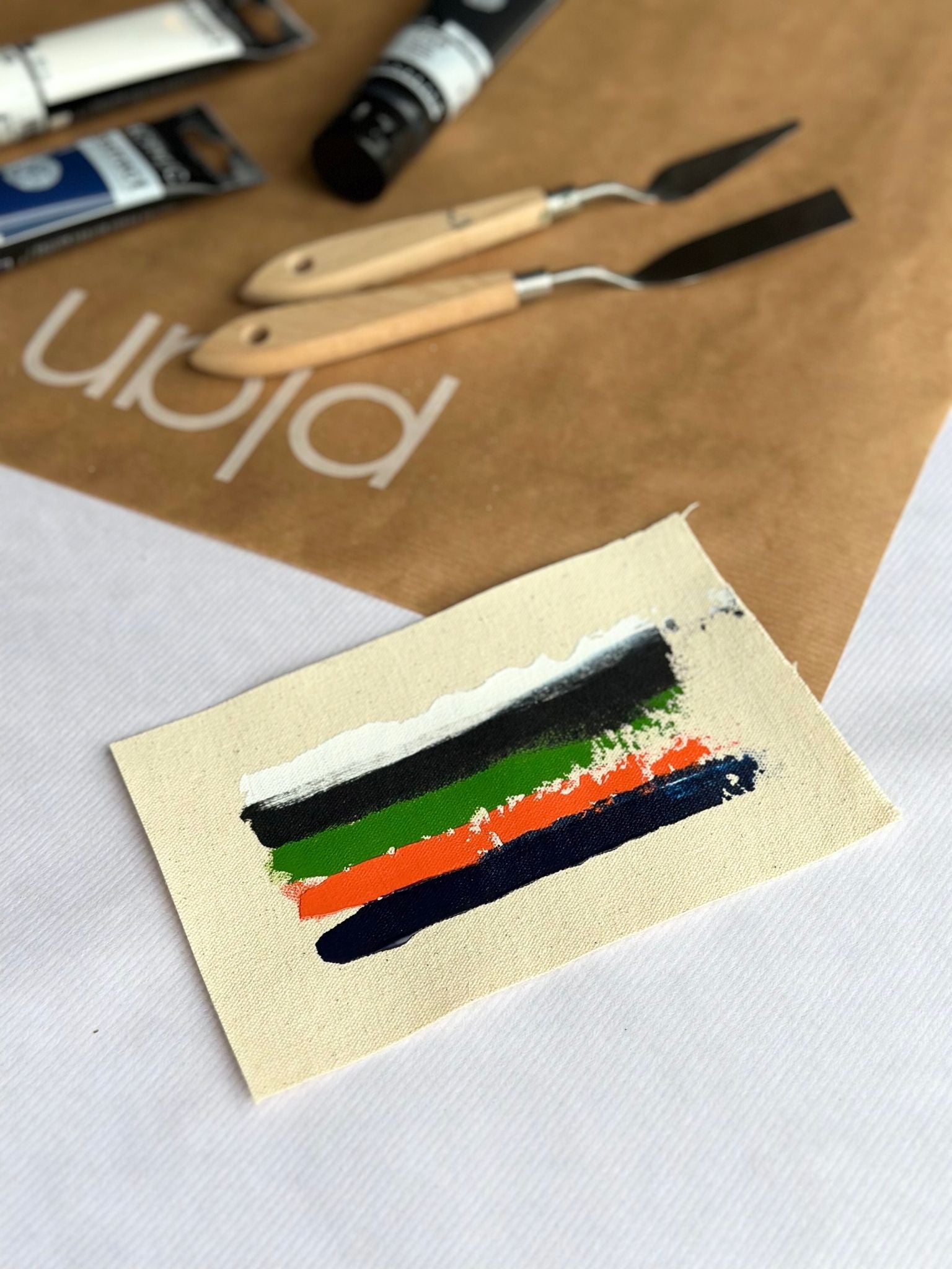 Navy & Bright colour palette swatch for Plan framed canvas art kit, featuring navy, black, white and vibrant accent colours including orange and green