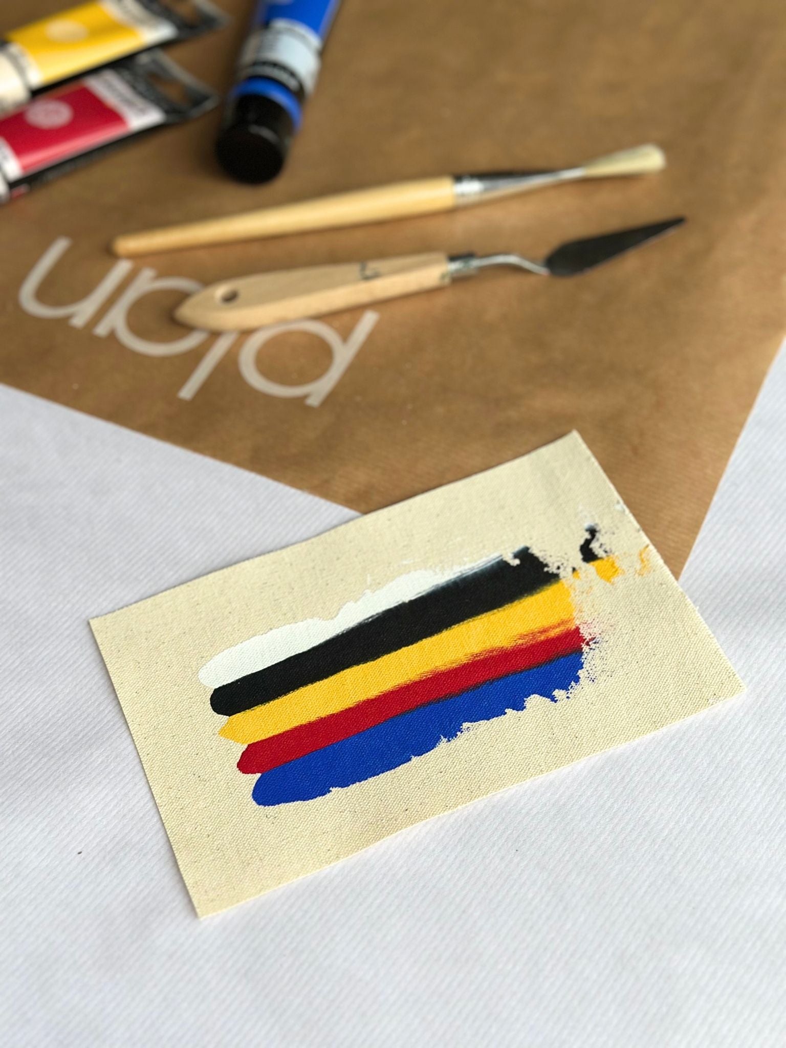 Mix colour palette swatch for Plan framed canvas art kit, featuring primary acrylic paints for colour mixing including red, blue, yellow, black and white