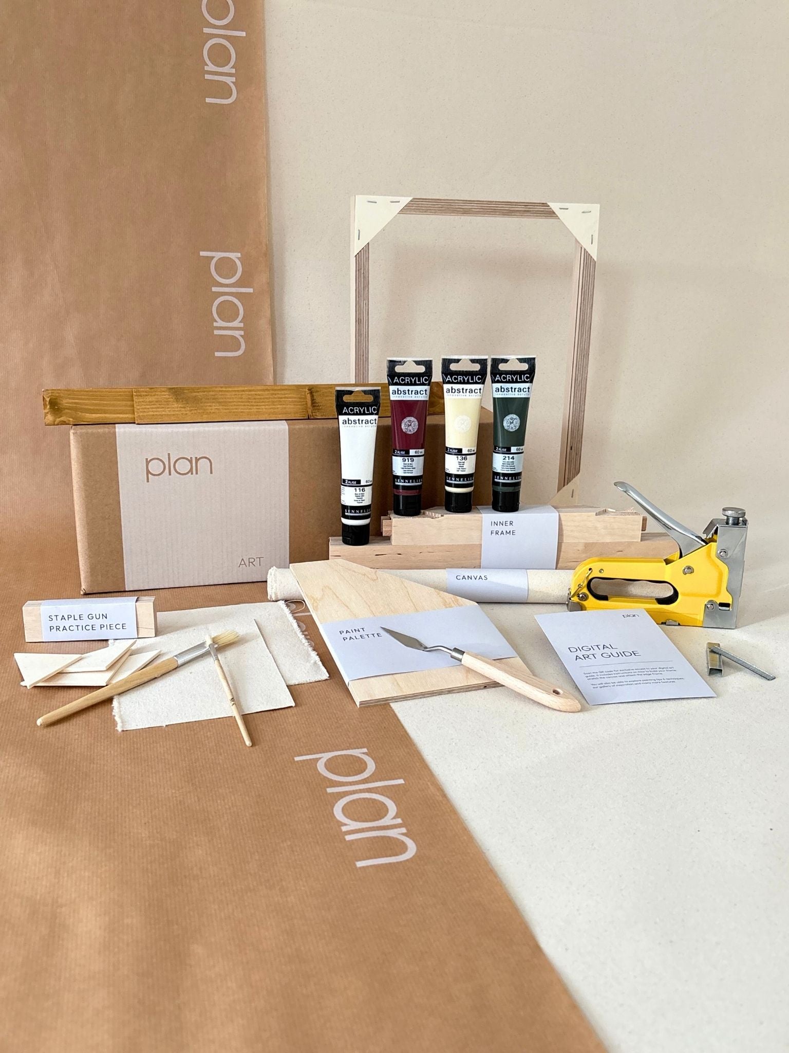 Forest Red framed canvas art kit by Plan, small 30 x 40 cm size with oak edge frame, showing frame, cotton canvas, acrylic paints and art tools