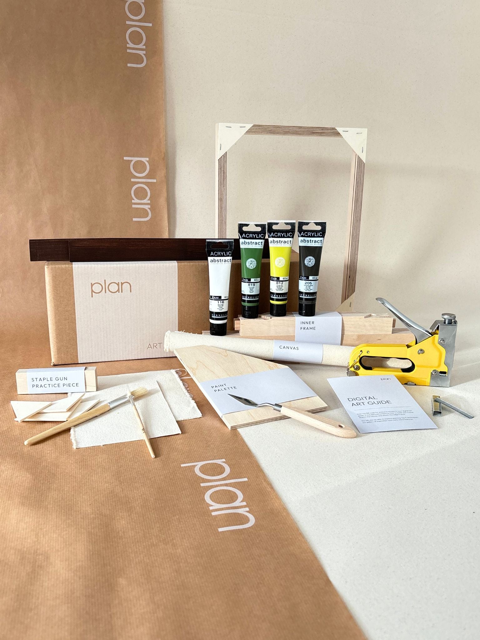 Olive framed canvas art kit by Plan, small 30 x 40 cm size with dark oak edge frame, showing frame, cotton canvas, acrylic paints and art tools