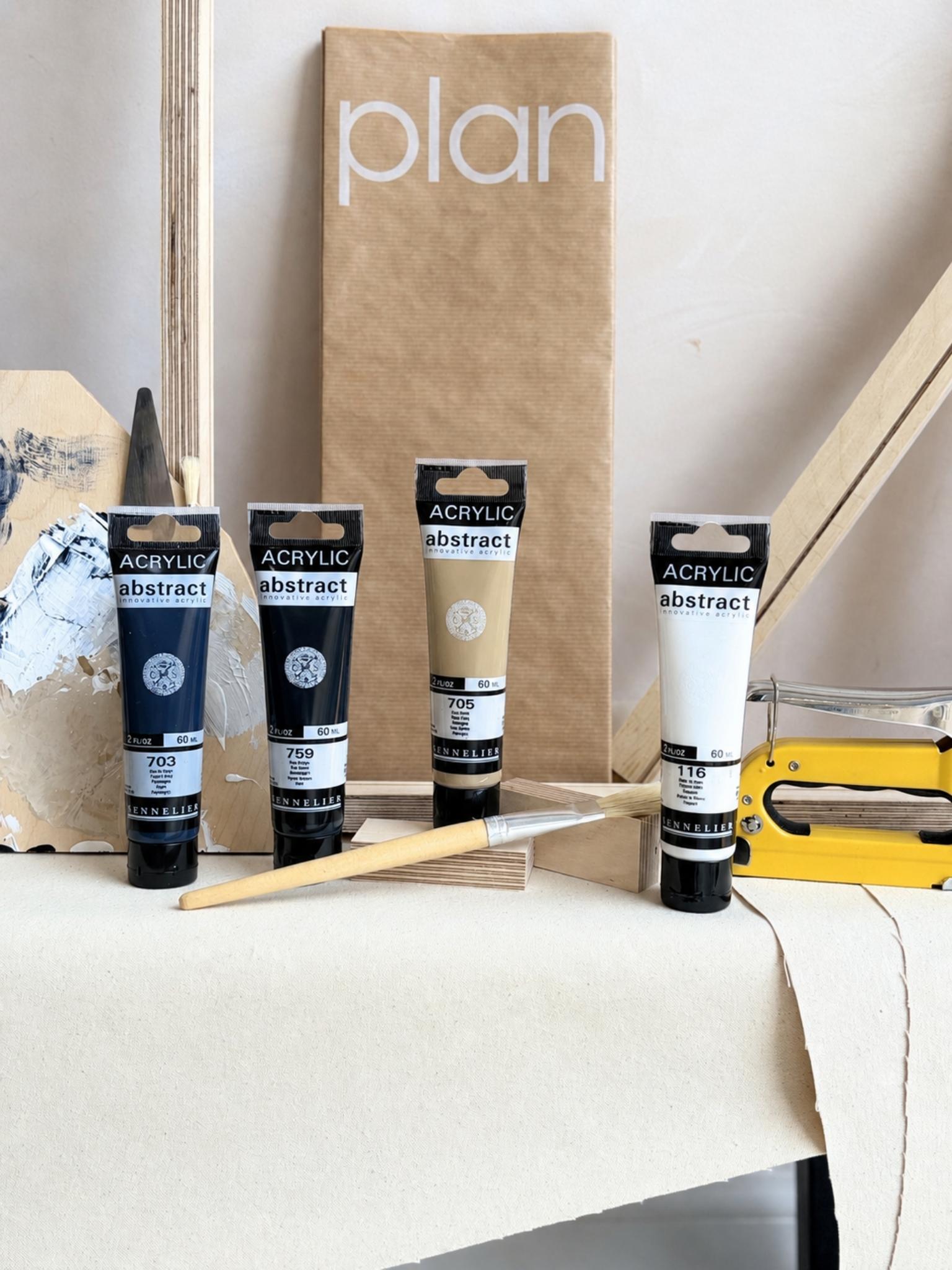 DIY framed canvas art kit with Monochrome cotton canvas palette with black, white, soft beige and rich navy. Acrylic paints, paintbrush and wooden frame pieces.