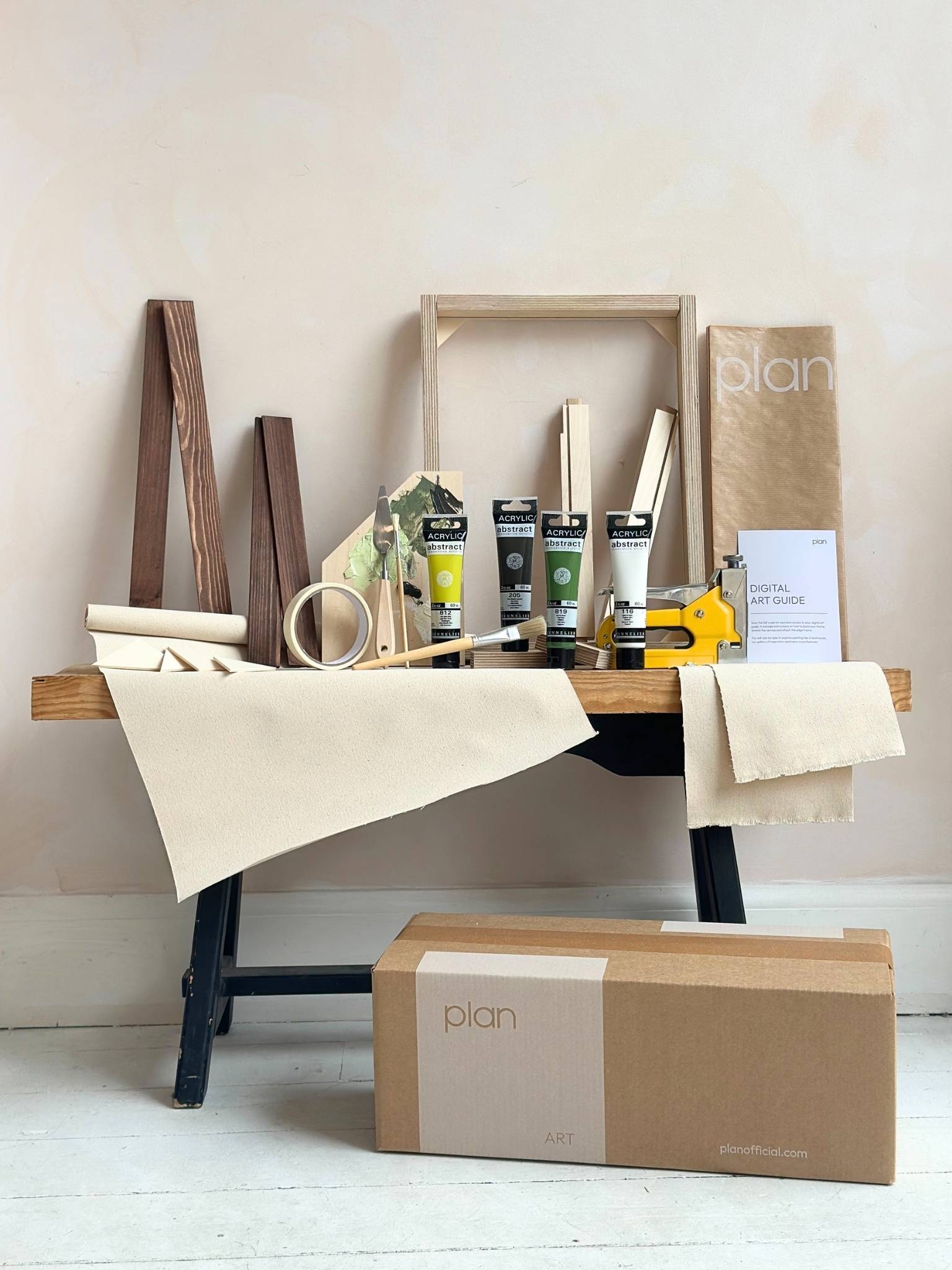 Olive framed canvas art kit by Plan, small 30 x 40 cm size with dark oak edge frame, showing frame, cotton canvas, acrylic paints and art tools.