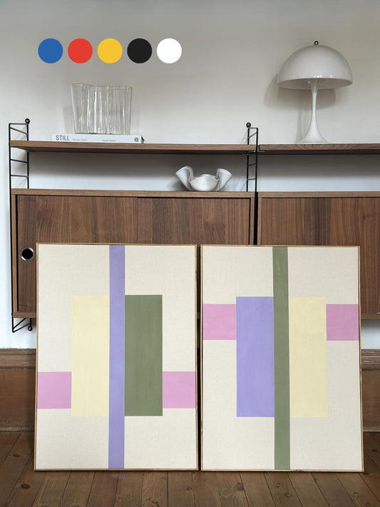 Large abstract framed canvas artworks in pastel colours with oak edge frame, made at home with PLAN DIY art kit, leaning against wooden shelving unit, modern DIY canvas art for home interiors