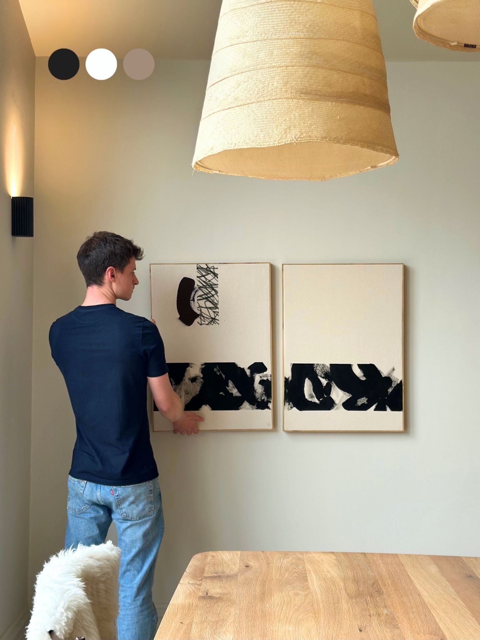 Finished monochrome abstract canvas artworks created with the Plan DIY framed canvas double art kit, shown being styled on the wall in a calm, modern home interior.