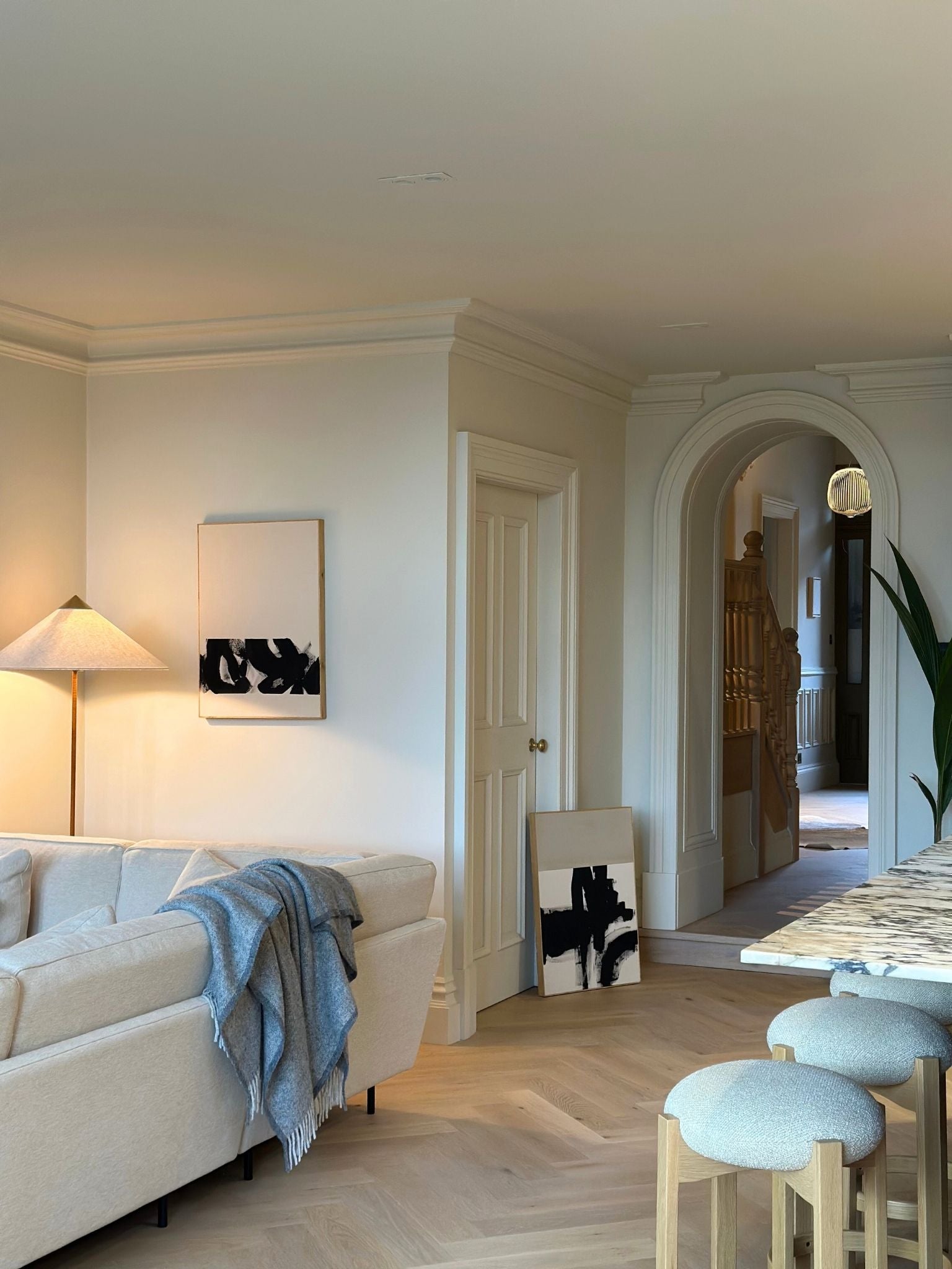 Monochrome abstract canvas artwork created with the Plan cotton double art kit, displayed in a calm living room setting with soft textures and natural light.