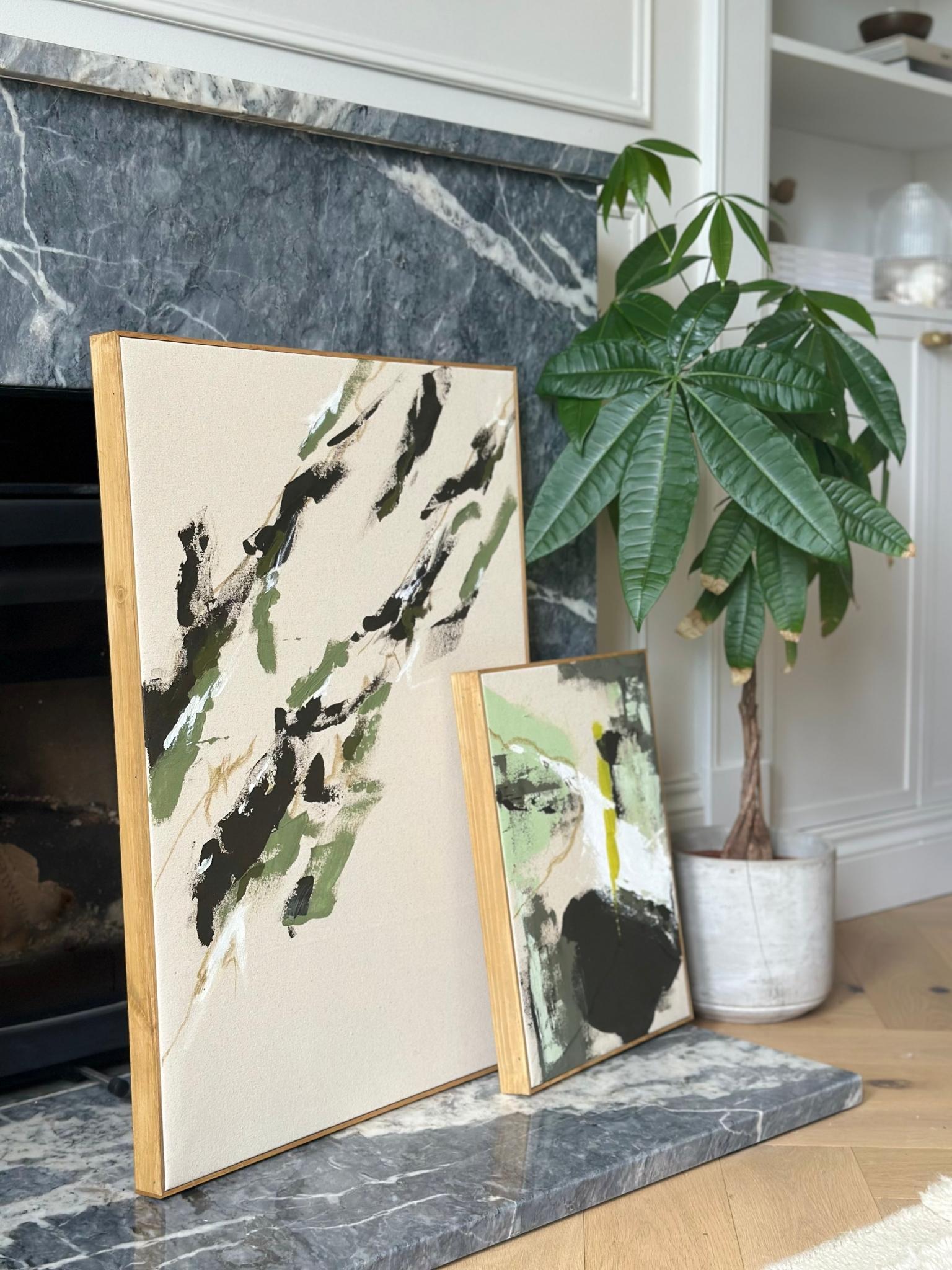 Olive framed canvas artworks displayed together in a modern living space, showing how a double art kit creates a coordinated yet unique pair.