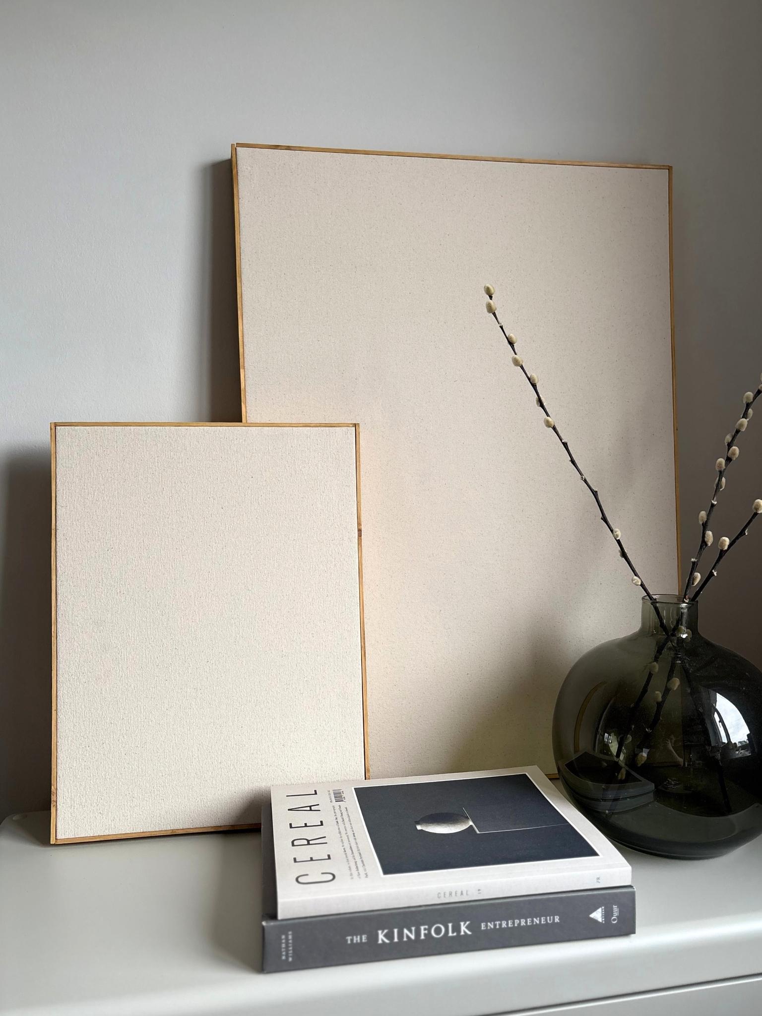 Framed blank cotton canvas art kits styled on a shelf, showing the finished look after building the frame at home using a premium DIY canvas art kit with handcrafted wooden frames.