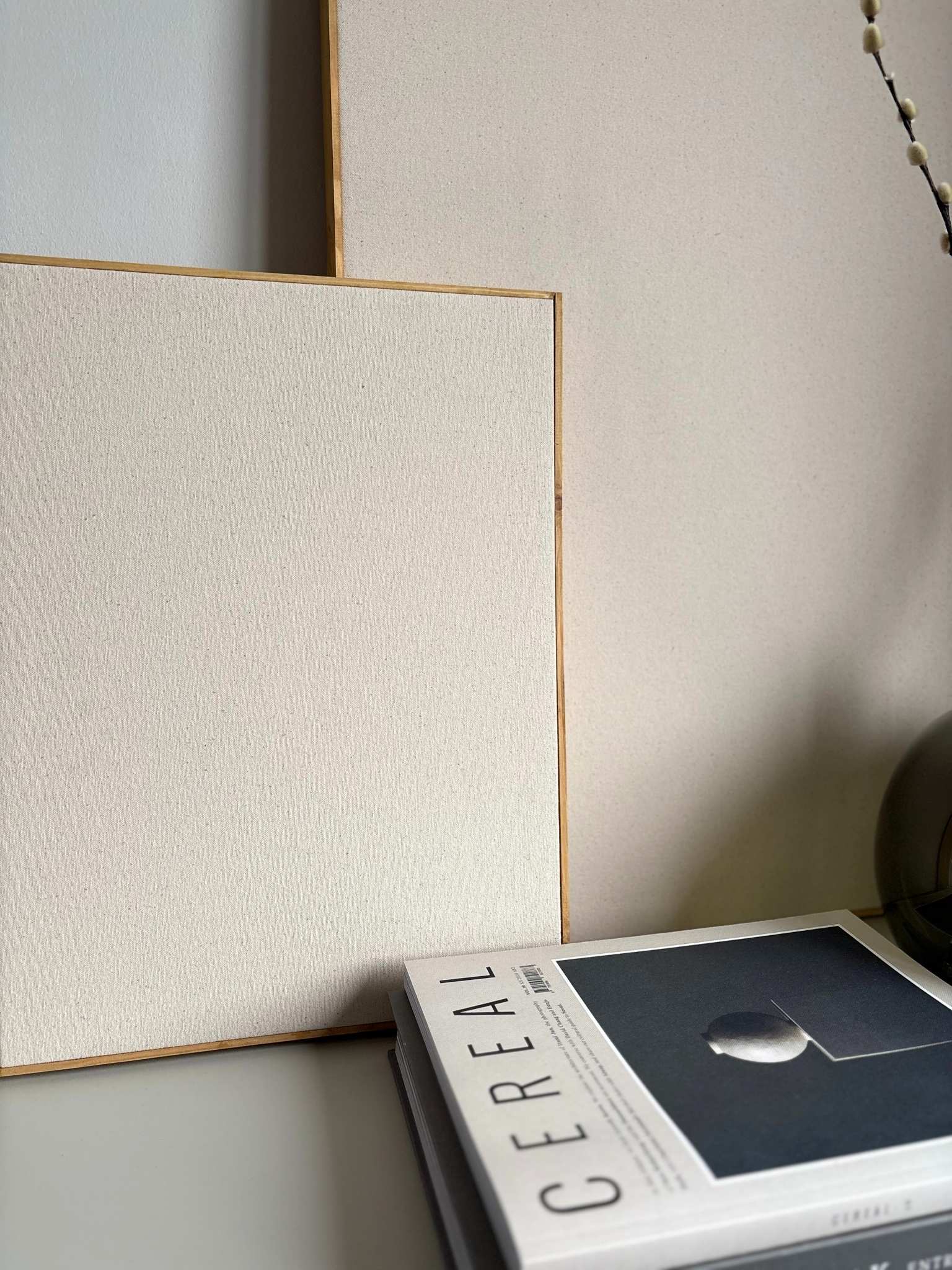 Close-up of cotton canvas texture and handcrafted oak edge frame from a DIY framed canvas art kit, highlighting the premium materials used to create your own art at home.